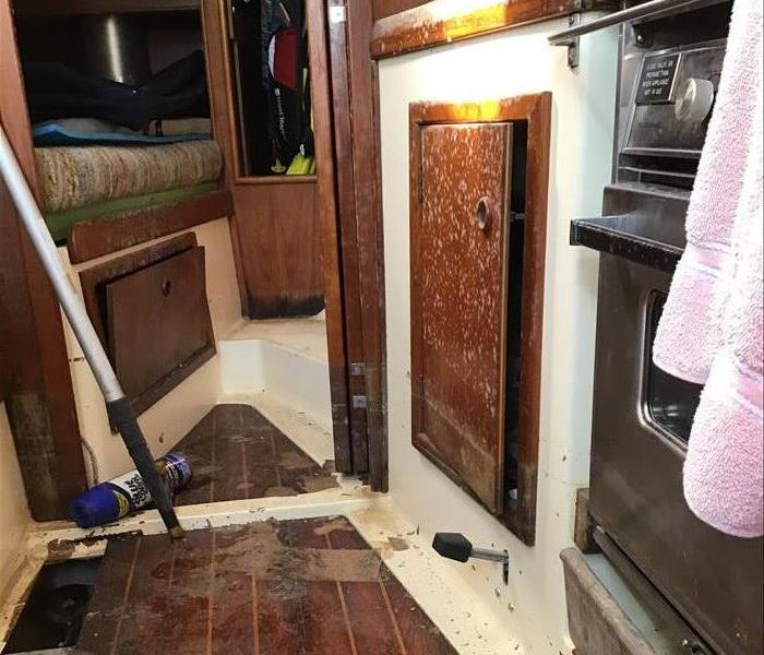 Photo of sailboat cabin with mold damage prior to cleaning